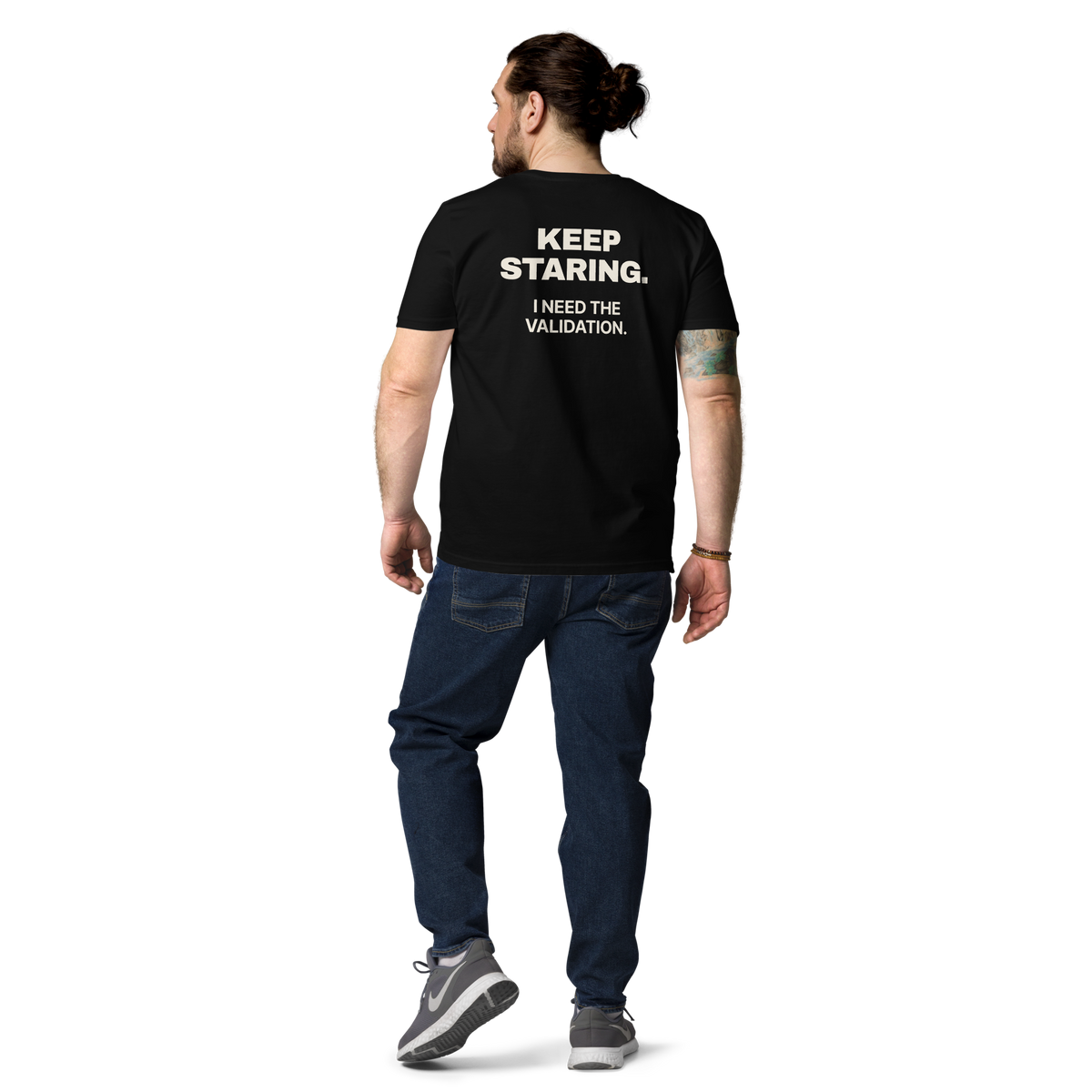 Man wearing the Keep Staring. I Need the Validation T-shirt in black, back view