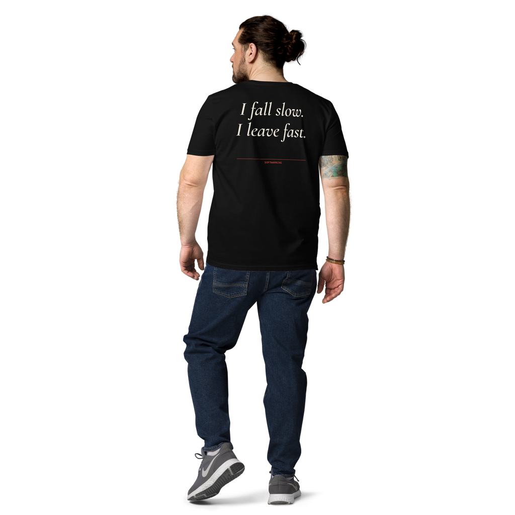 Man wearing the I Fall Slow. I Leave Fast T-shirt in black, back view