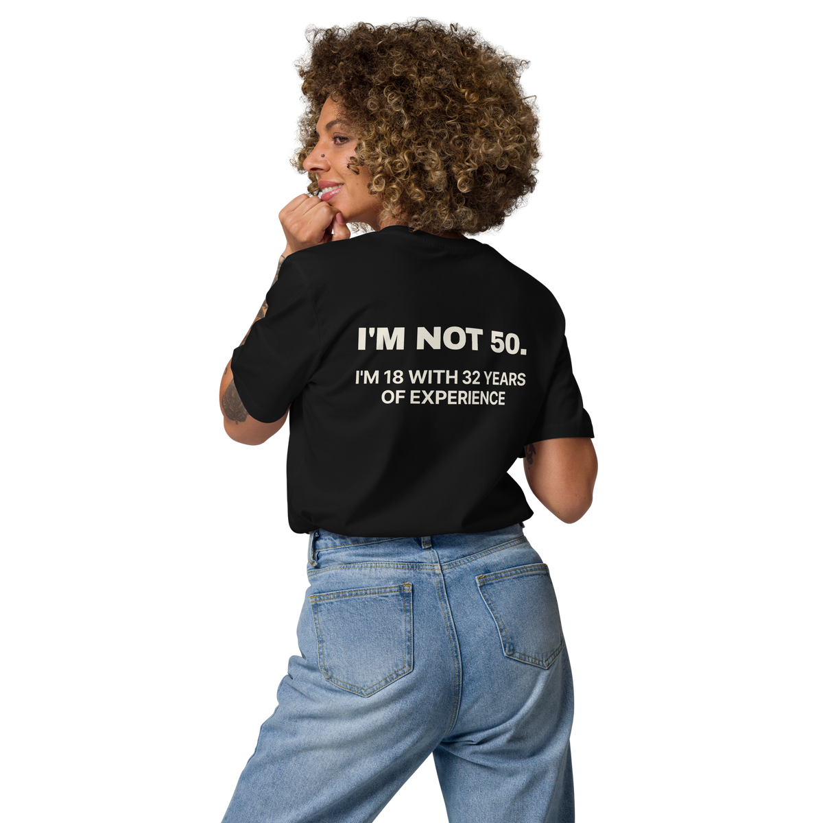 Woman wearing the I’m Not 50. I’m 18 with 32 Years of Experience T-shirt in black, back view