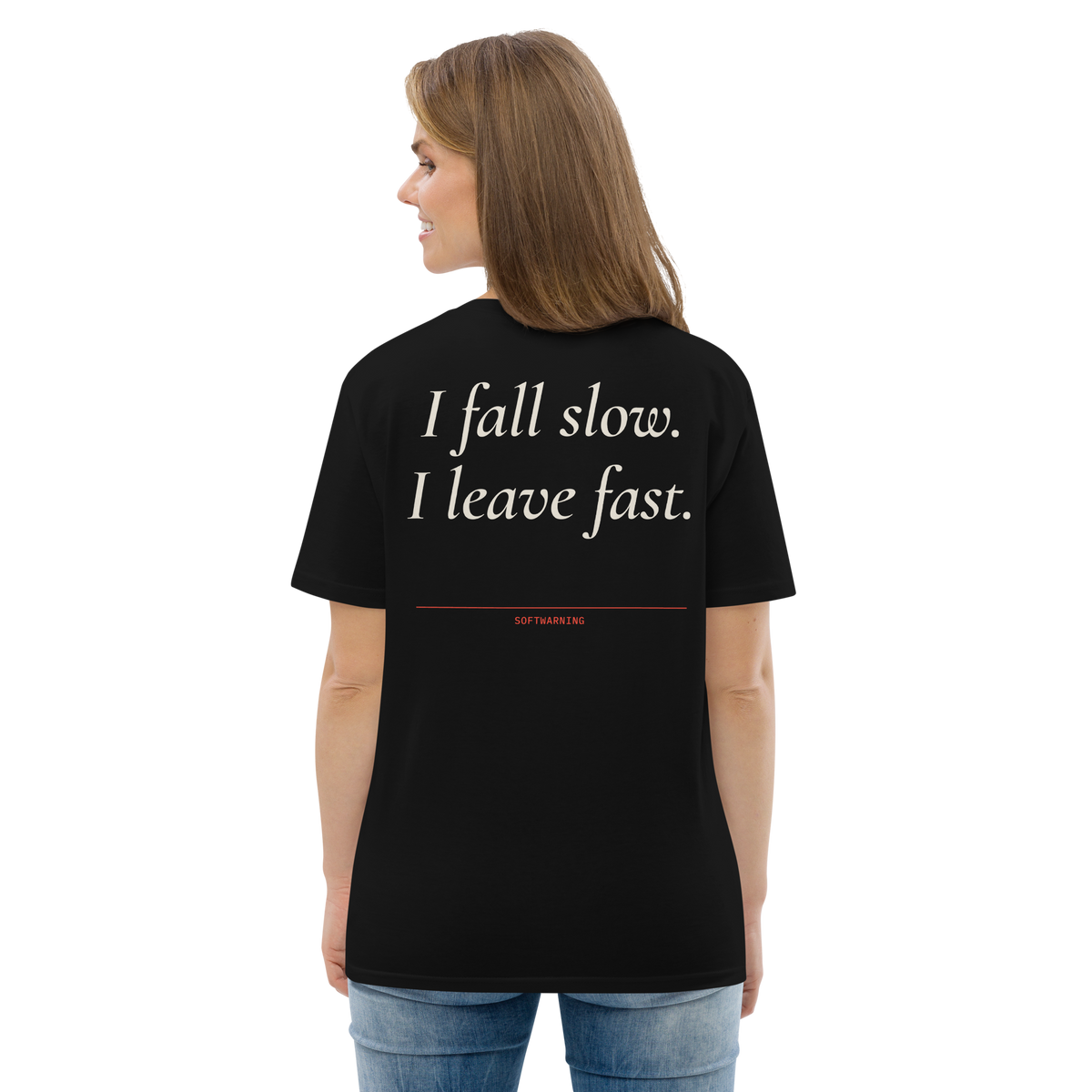 Woman wearing the I Fall Slow. I Leave Fast T-shirt in black, back view