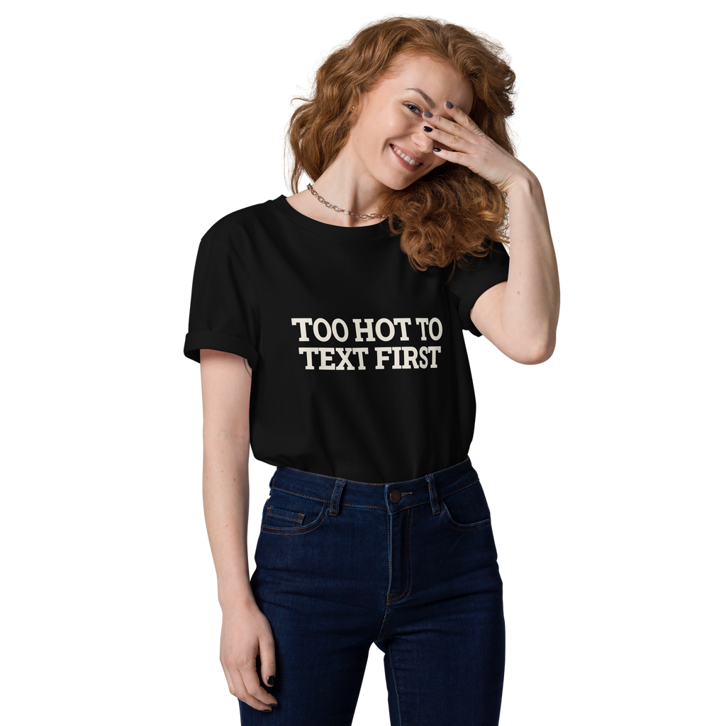 Woman wearing the Too Hot to Text First T-shirt in black, front view