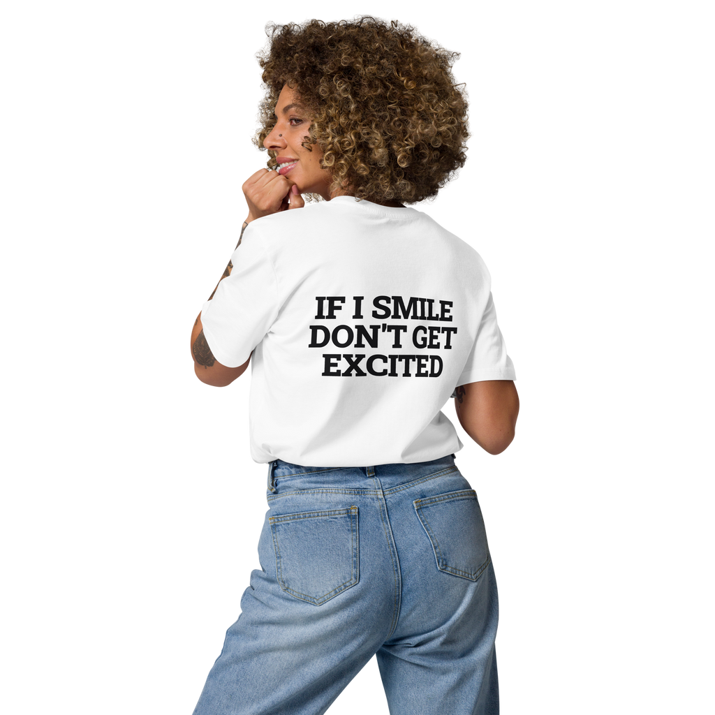 Woman wearing the If I Smile, Don’t Get Excited T-shirt in white, back view