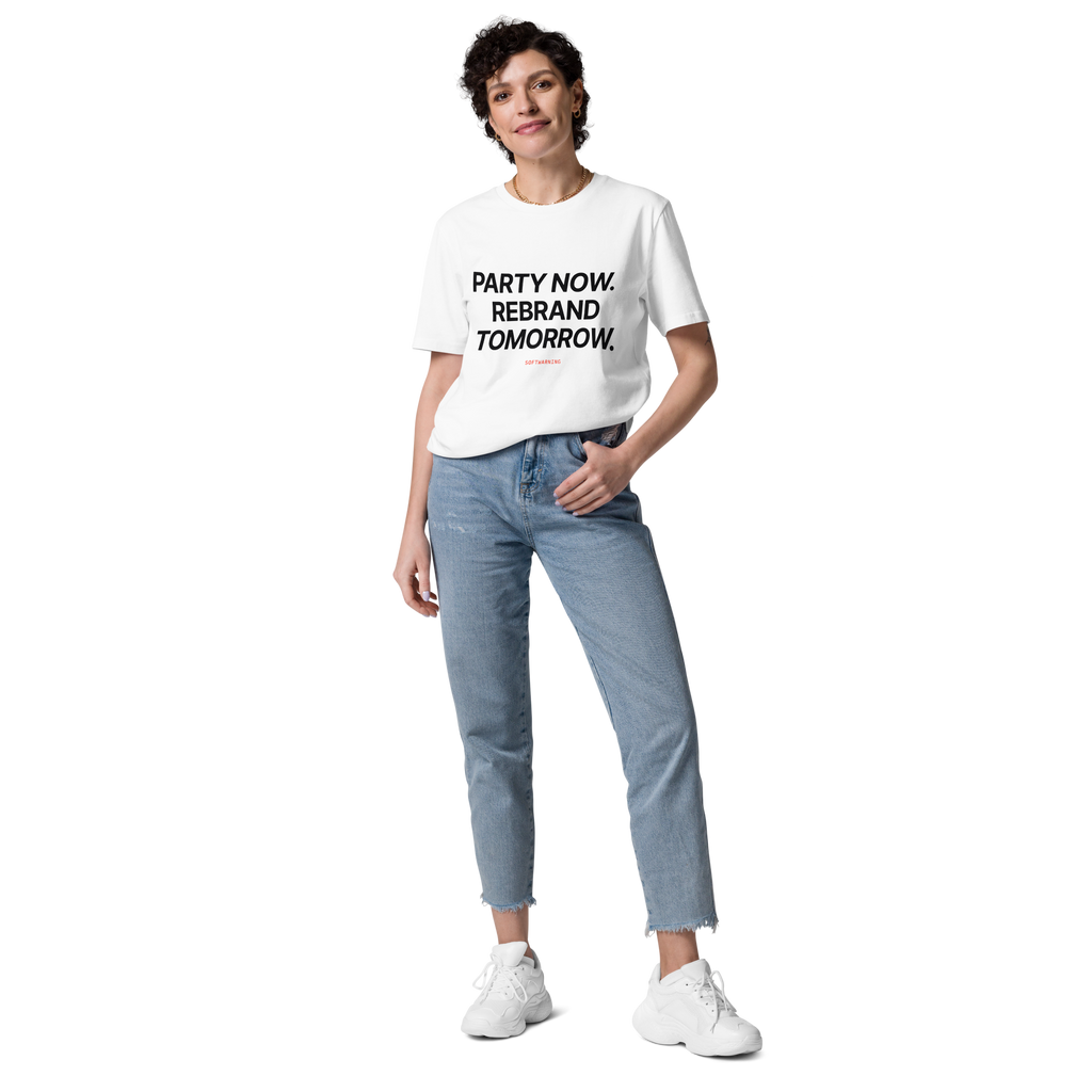 Woman wearing the Party Now. Rebrand Tomorrow T-shirt in white, front view