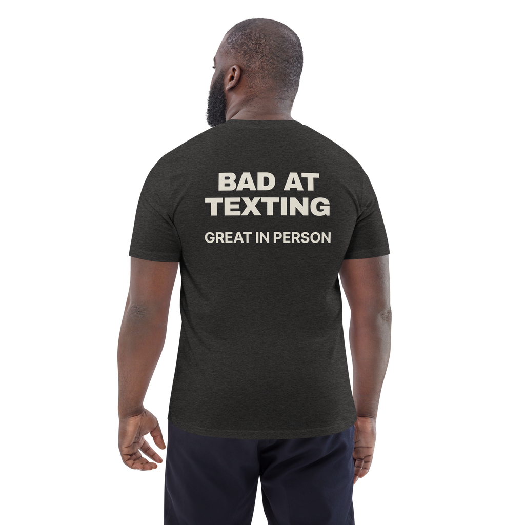 Man wearing the Bad at Texting, Great in Person T-shirt in dark heather grey, back view