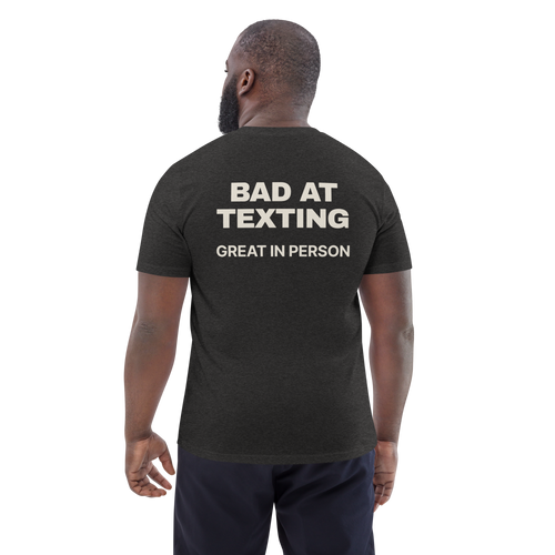 Man wearing the Bad at Texting, Great in Person T-shirt in dark heather grey, back view
