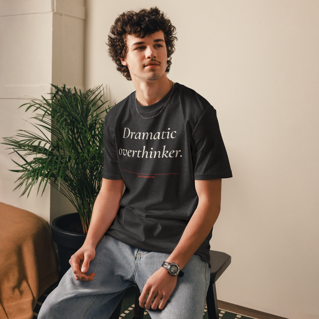 Man wearing the Dramatic Overthinker T-shirt in dark heather grey, front view