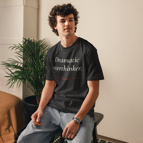 Man wearing the Dramatic Overthinker T-shirt in dark heather grey, front view