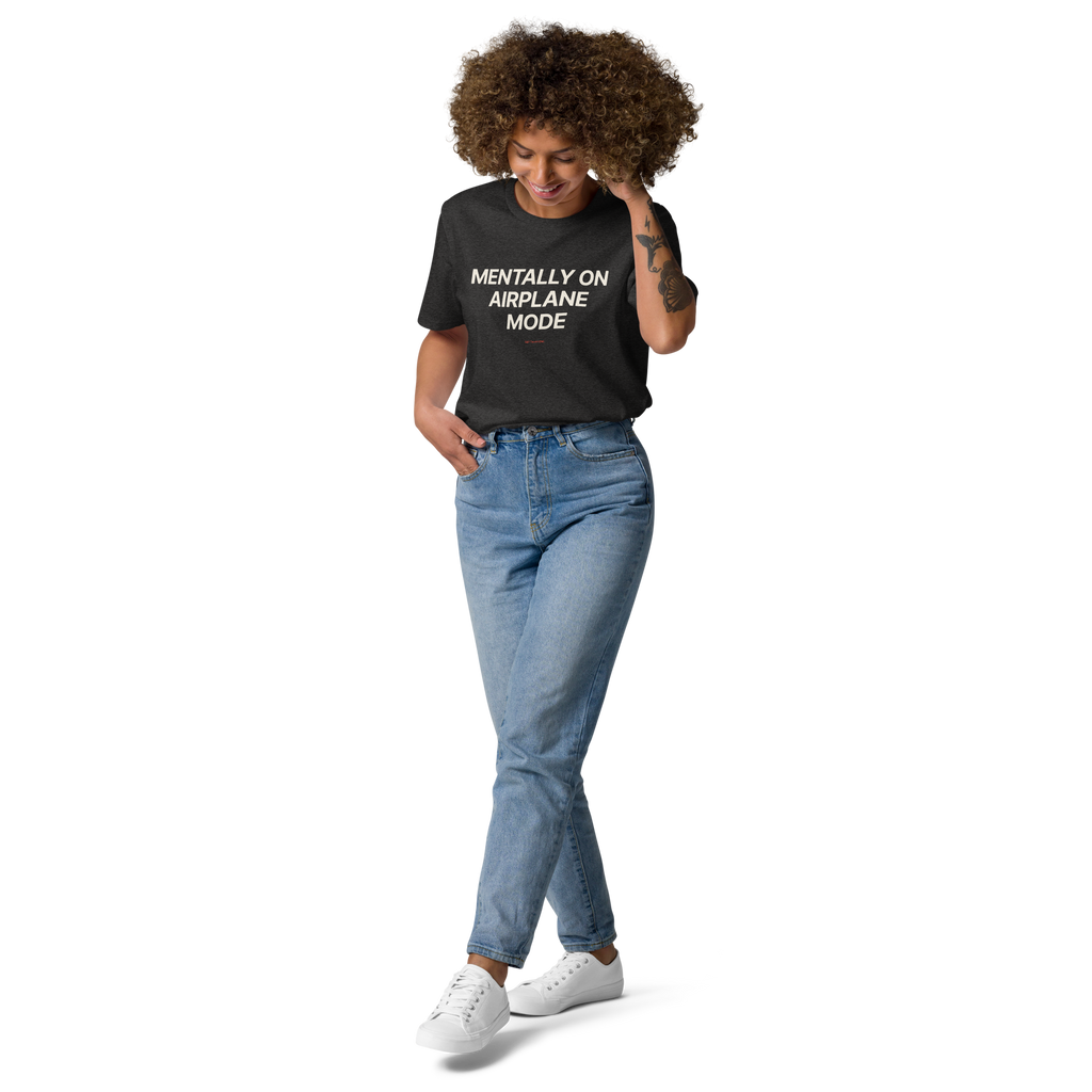 Woman wearing the Mentally on Airplane Mode T-shirt in dark heather grey, front view