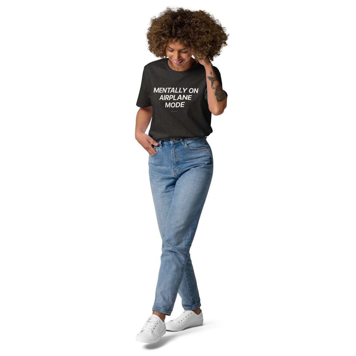 Woman wearing the Mentally on Airplane Mode T-shirt in dark heather grey, front view